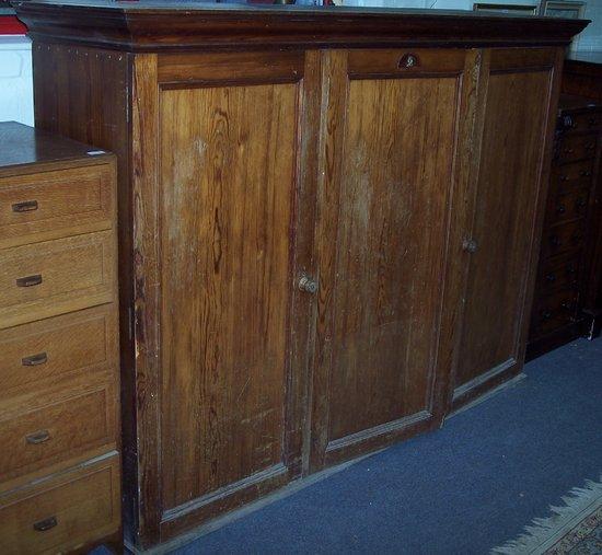 Appraisal: A late th Century pitch pine cupboard enclosed by three