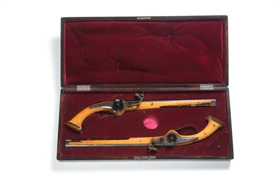 Appraisal: TWO CASED WHEELLOCK PISTOLS European th century Light fruitwood stocks