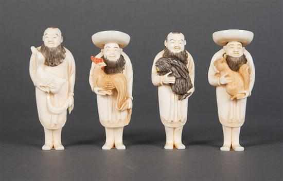 Appraisal: Four Japanese carved ivory figural netsukes th century each modeled