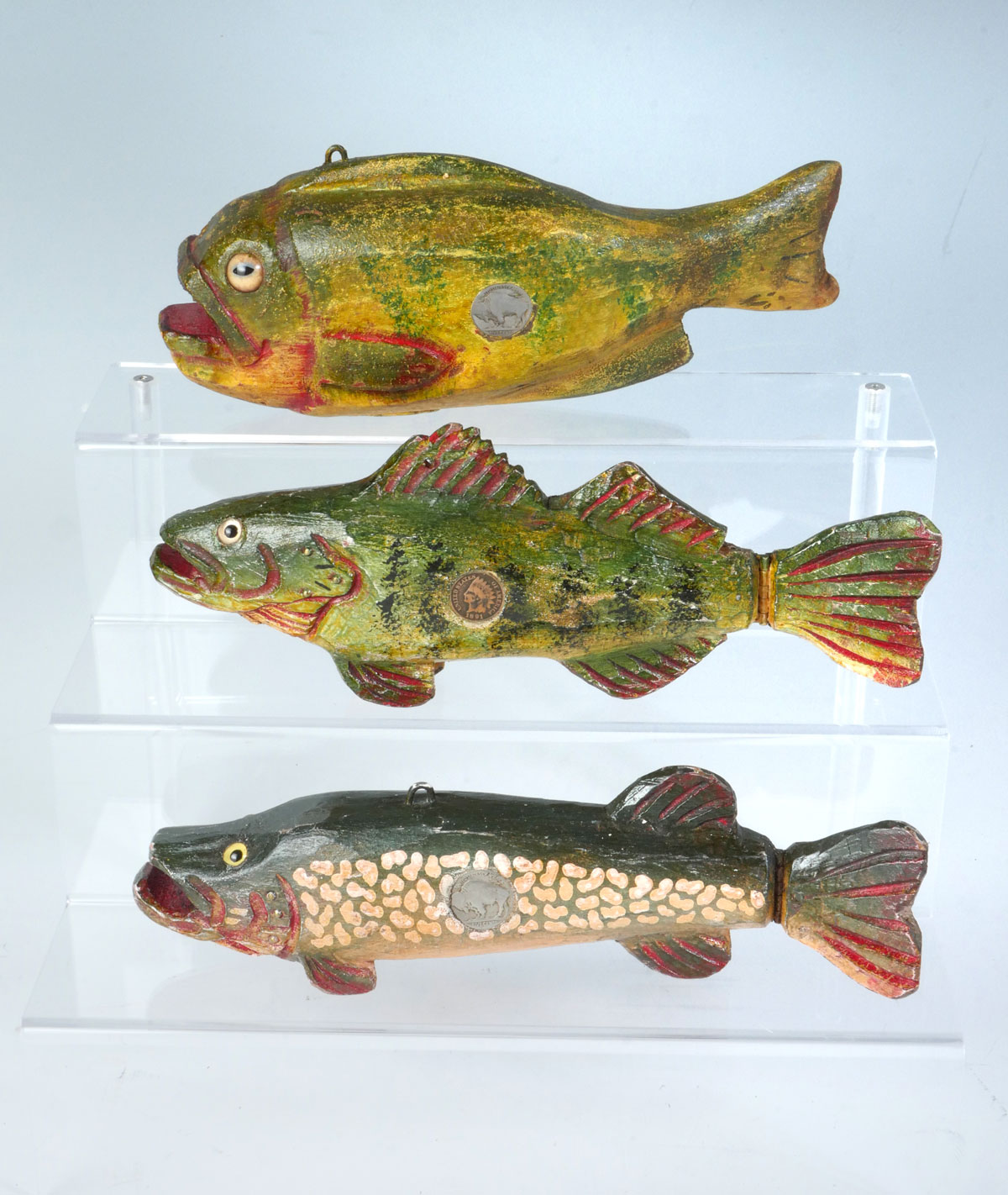 Appraisal: THREE DULUTH FISH DECOY COMPANY DECOYS All carved and painted