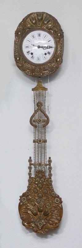 Appraisal: FRENCH MORBIER WAG ON THE WALL CLOCK Embossed floral motif