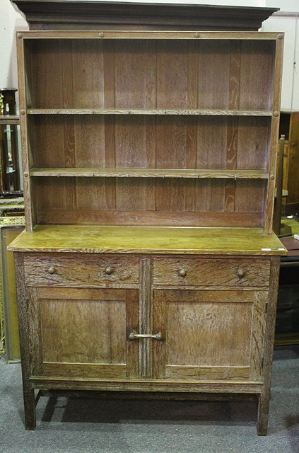 Appraisal: A HEALS LIMED OAK DRESSER with raised shelf back front