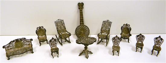 Appraisal: Silvertone filigree miniature dollhouse furniture including sofa two rocking chairs