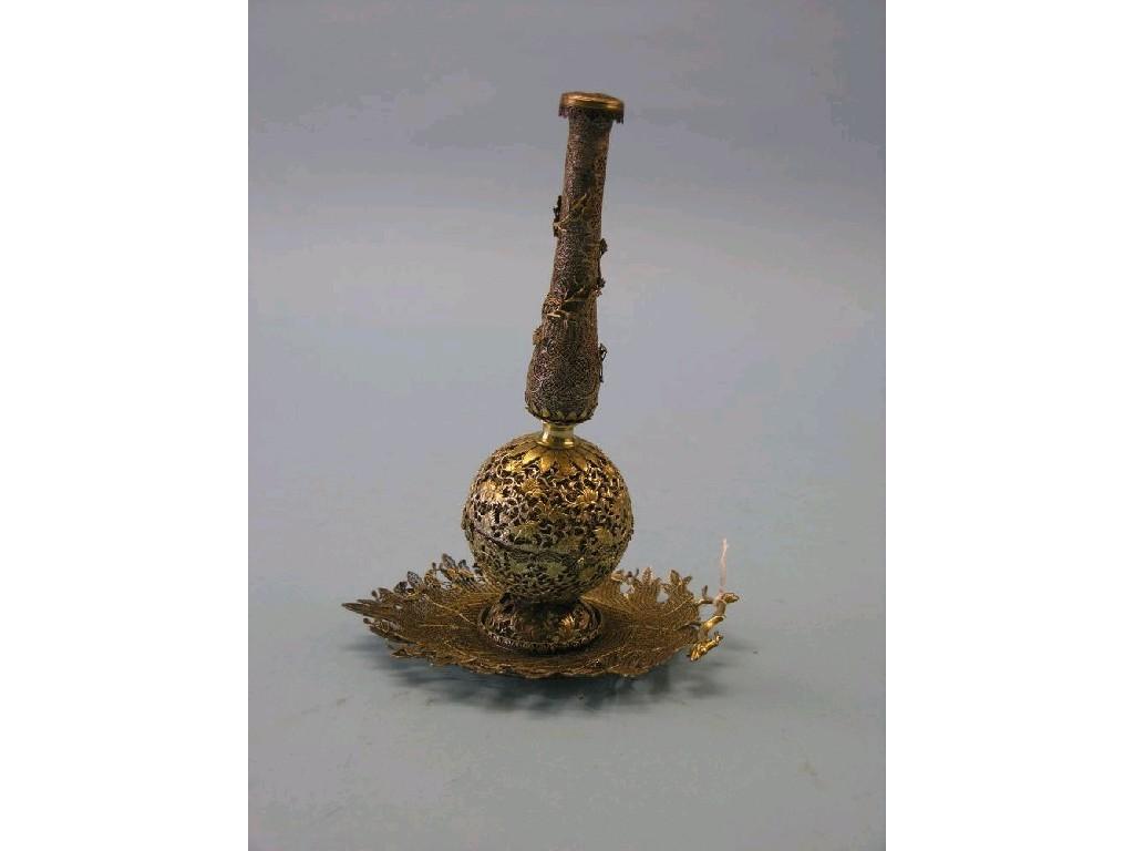 Appraisal: A gilt on white metal holy water bottle the whole