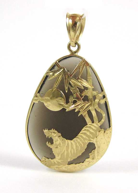 Appraisal: SMOKY QUARTZ AND FOURTEEN KARAT GOLD PENDANT having a pear