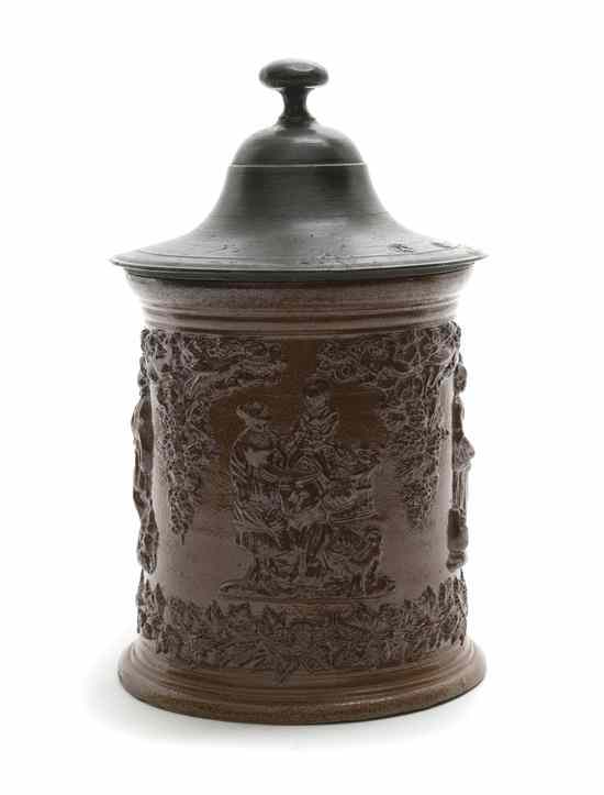 Appraisal: An English Stoneware Tobacco Jar having a flared pewter lid