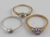 Appraisal: Two carat gold gem set rings and a white metal