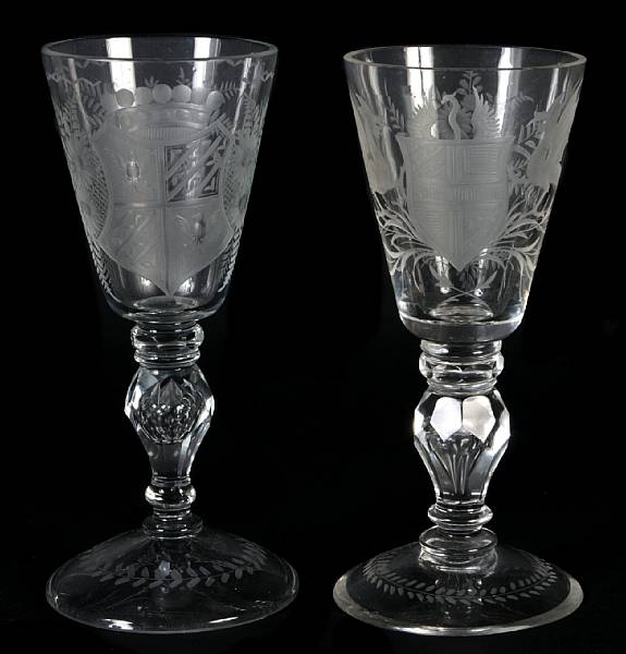 Appraisal: A pair of armorial etched wine glasses together with a