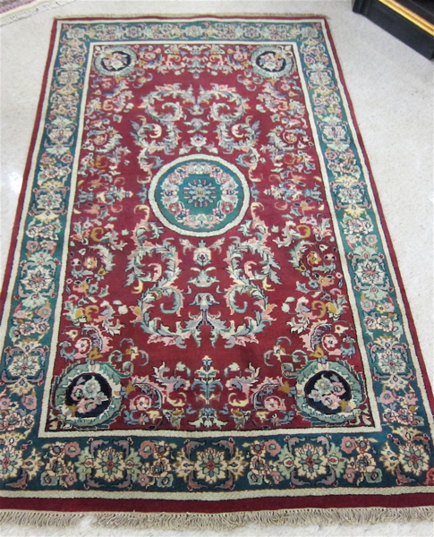 Appraisal: HAND KNOTTED ORIENTAL AREA RUG Indo-Persian floral disk medallion and