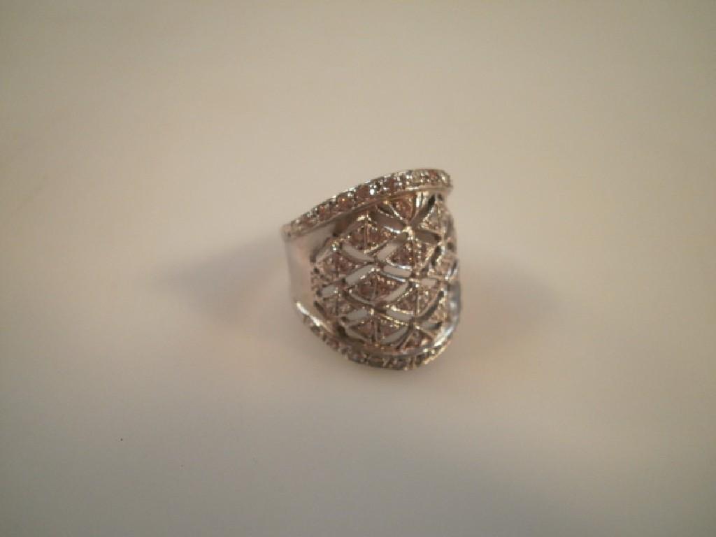 Appraisal: A large openwork dress ring set with small diamonds stamped