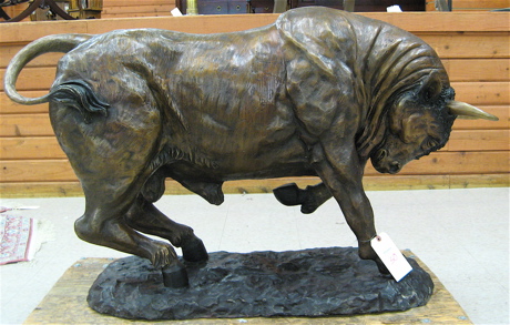 Appraisal: LARGE BRONZE WILDLIFE FLOOR SCULPTURE the figure of a charging