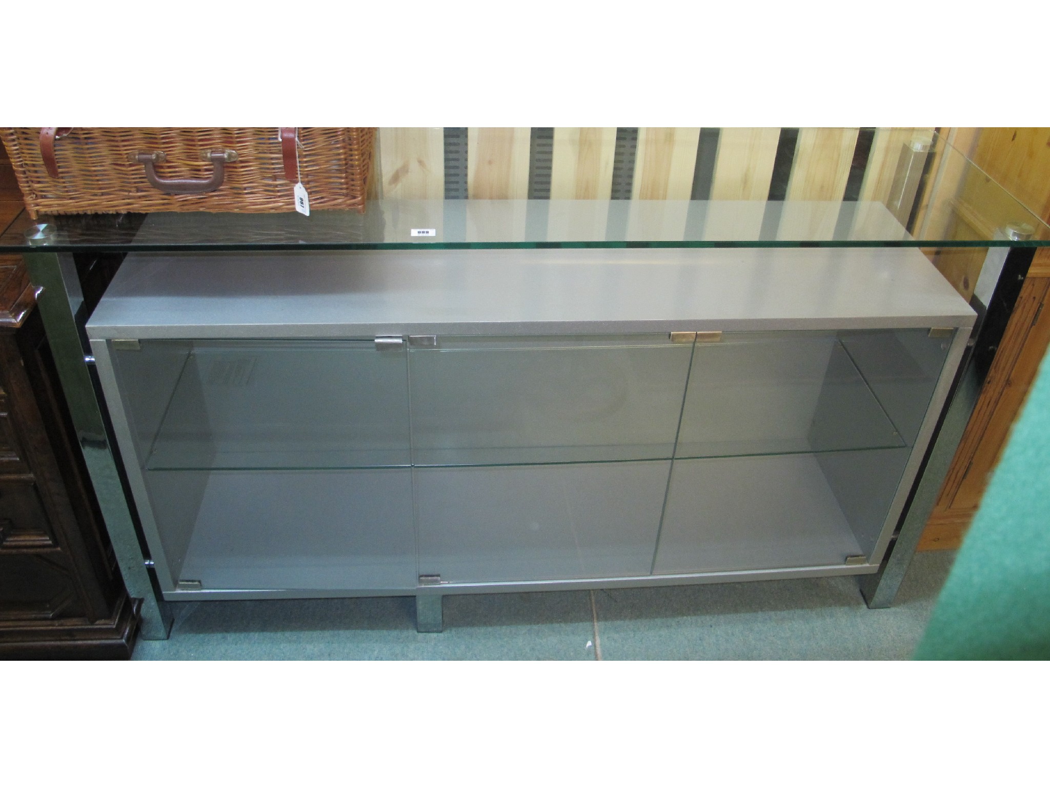 Appraisal: Glass and steel three door display cabinet