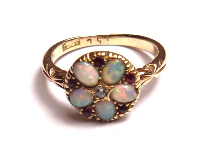 Appraisal: A gold diamond opal and ruby set cluster ring mounted