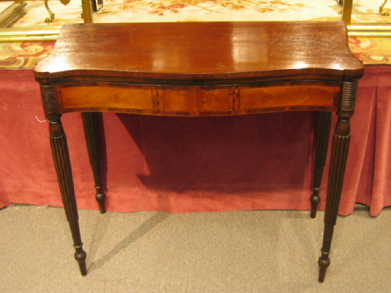 Appraisal: AMERICAN FEDERAL MAHOGANY GAMES TABLE Hinged shaped top with inlayed