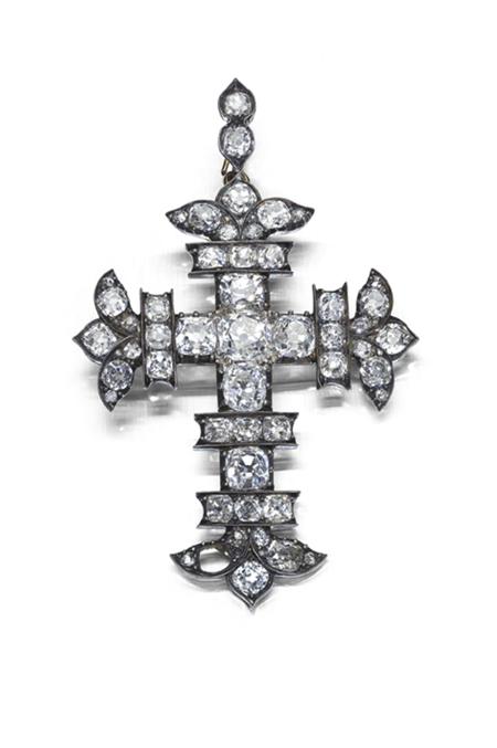 Appraisal: A Victorian diamond set cross form pendant with foliate stylised