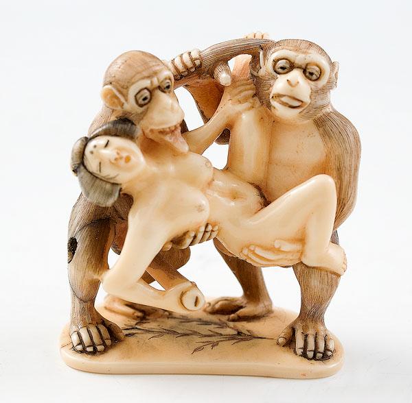 Appraisal: EROTIC JAPANESE CARVED IVORY FIGURINE with two macaque male monkeys