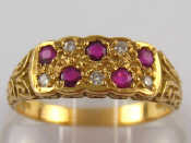 Appraisal: An carat gold ruby and diamond ring approx mm wide