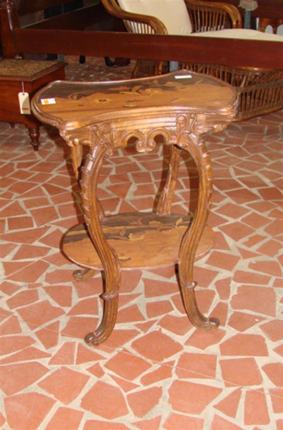 Appraisal: Art Nouveau style mixed wood side table shaped and molded