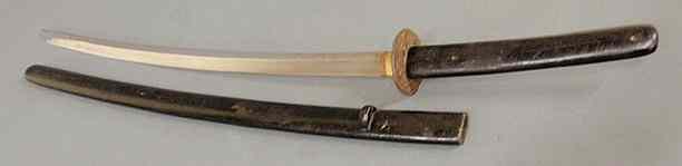 Appraisal: Japanese Samurai sword with dragon decorated tsuka and ebonized wood