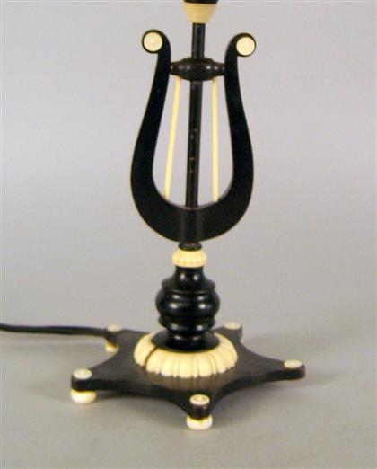 Appraisal: Continental ivory and ebonized lamp Formed as a lyre H