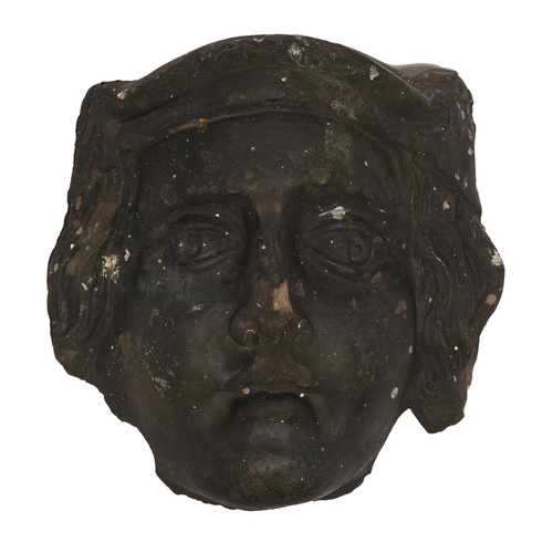 Appraisal: A carved sandstone face of a Saint th early th