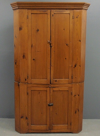 Appraisal: - Pine two-piece blind door corner cupboard c with a