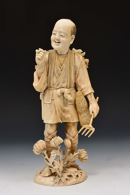 Appraisal: A Japanese ivory okimono of a man smoking a pipeMeiji