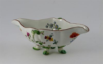 Appraisal: A Meissen two-handled sauceboat painted with polychrome flower sprays and