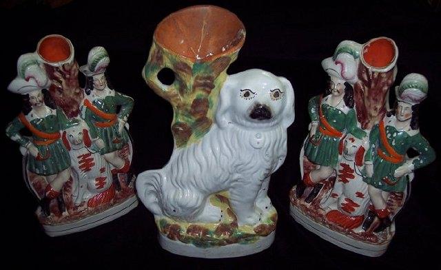 Appraisal: A pair of Staffordshire spill vases hunters and gun dogs