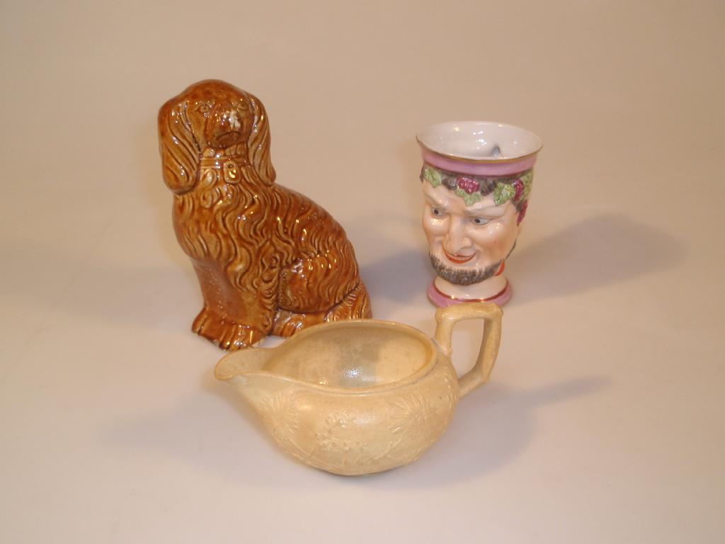 Appraisal: A Continental porcelain mug modelled as a grinning fawn wearing