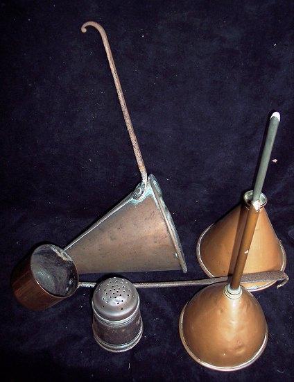 Appraisal: Two copper funnels a copper cider measure of conical form