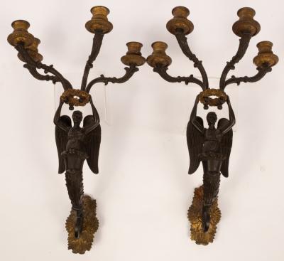 Appraisal: A pair of Empire bronze and ormolu mounted four-branch wall