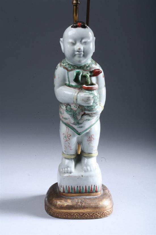 Appraisal: CHINESE FAMILLE VERTE PORCELAIN FIGURE OF BOY Kangxi period Standing