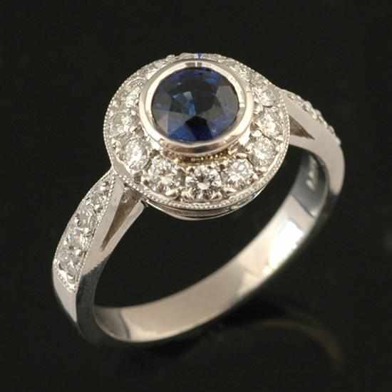 Appraisal: A sapphire and diamond dress ring Of cluster design centrally