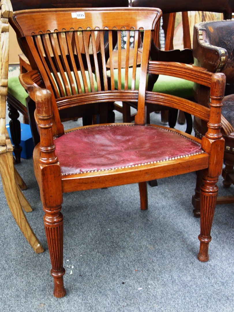 Appraisal: A late th century walnut tub back desk chair on