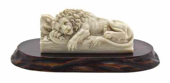 Appraisal: A Continental Carved Ivory Figure of the Lion of Lucerne