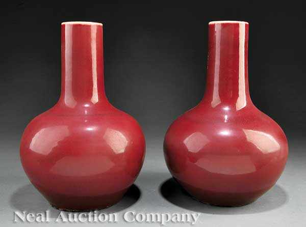 Appraisal: A Pair of Chinese Sang-de-Boeuf Porcelain Bottle Vases th c