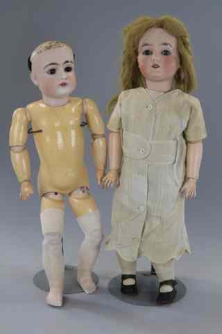 Appraisal: LOT OF TWO GERMAN BISQUE HEAD DOLLS The larger is