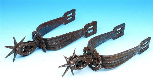 Appraisal: A PAIR OF POSSIBLY ANTIQUE STEEL SPURS with stamped and