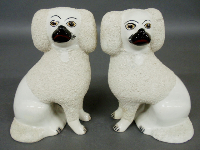 Appraisal: - Pair of Staffordshire white seated poodles c h x