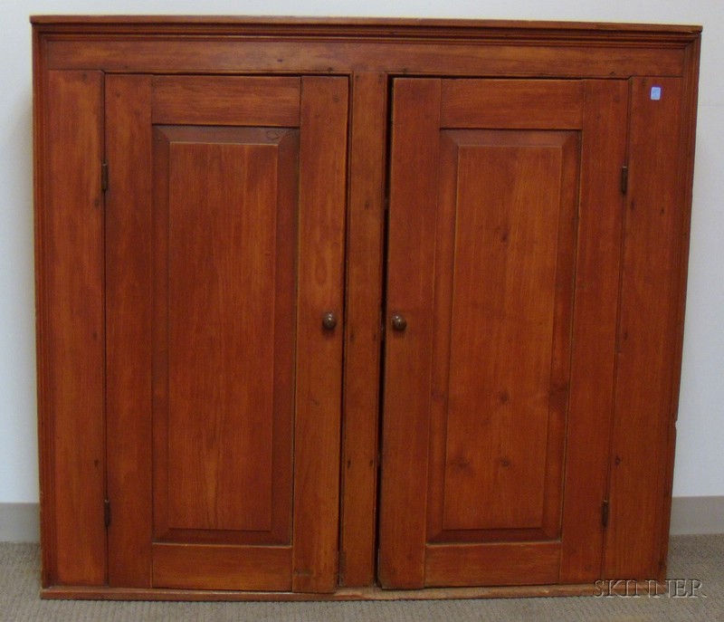 Appraisal: Red-painted Pine Two-Door Cupboard the interior with three fixed shelves