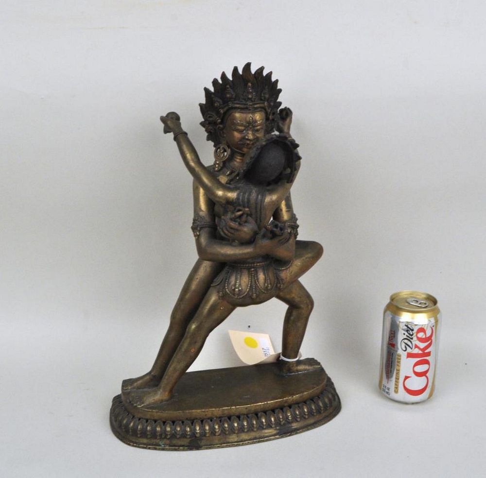 Appraisal: Tibetan Bronze Figure of Vajrapani and Consort the standing protector