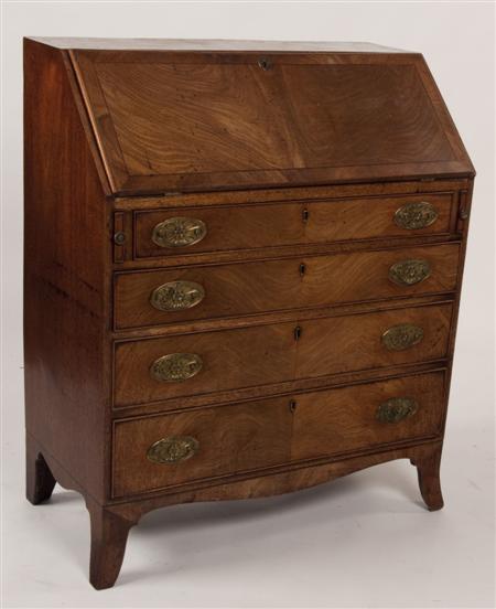 Appraisal: A George III mahogany bureau the crossbanded fall-flap enclosing a