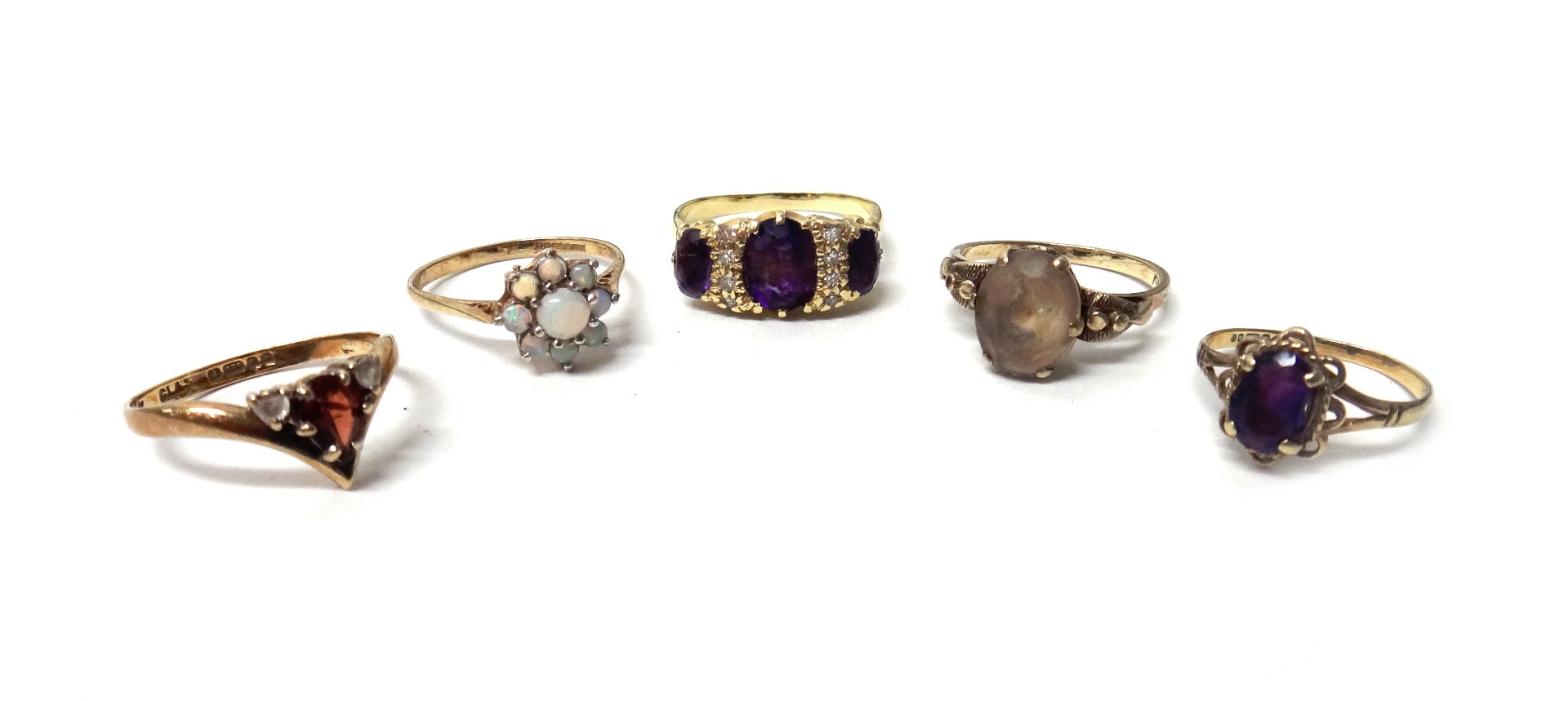 Appraisal: A gold amethyst and diamond ring claw set with three