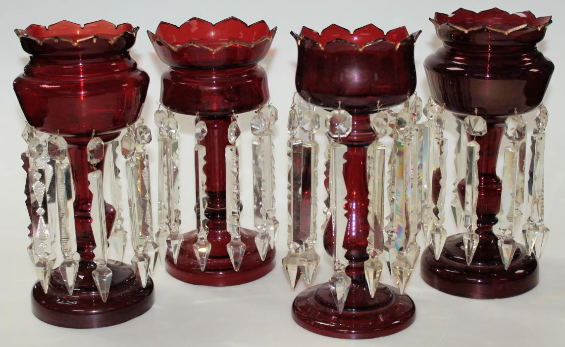 Appraisal: A near matching pair of Victorian ruby glass lustres each