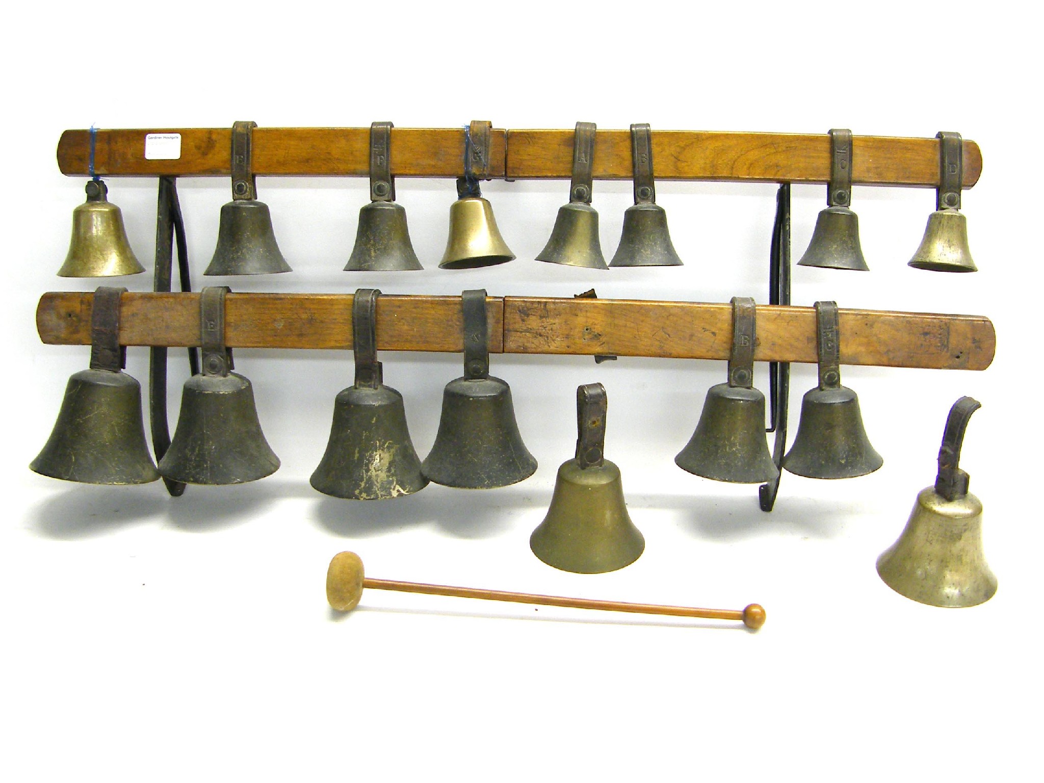 Appraisal: Interesting graduated set of bells upon a wooden stand at