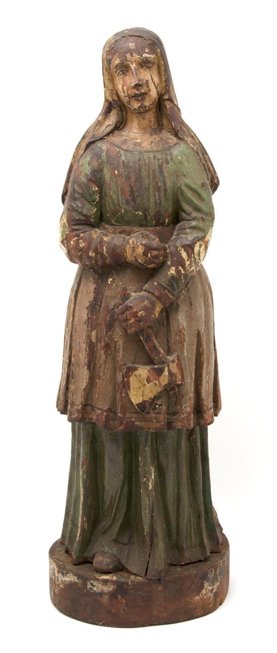 Appraisal: Carved Wood Figure of St Agatha shown holding an axe