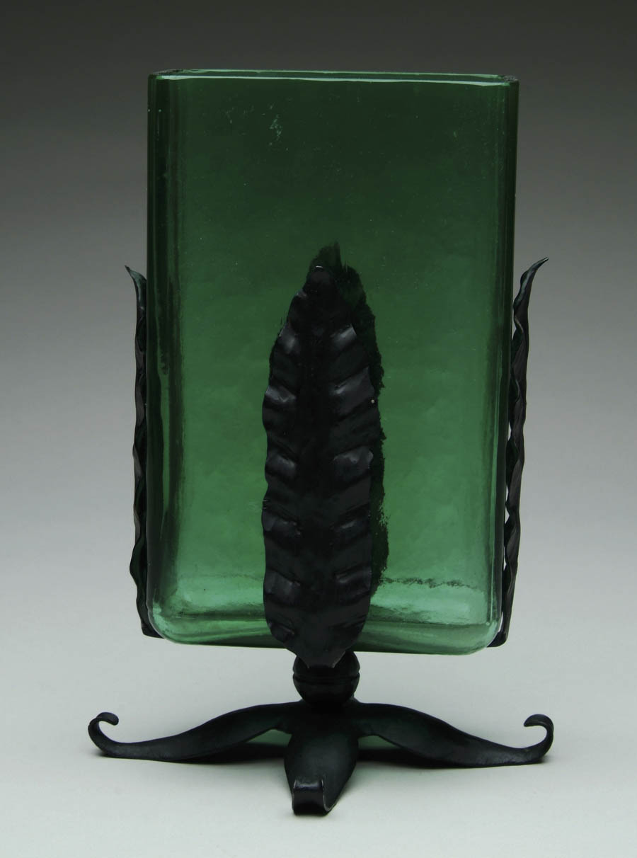 Appraisal: STEUBEN VASE Rich green Steuben square vase rests in a