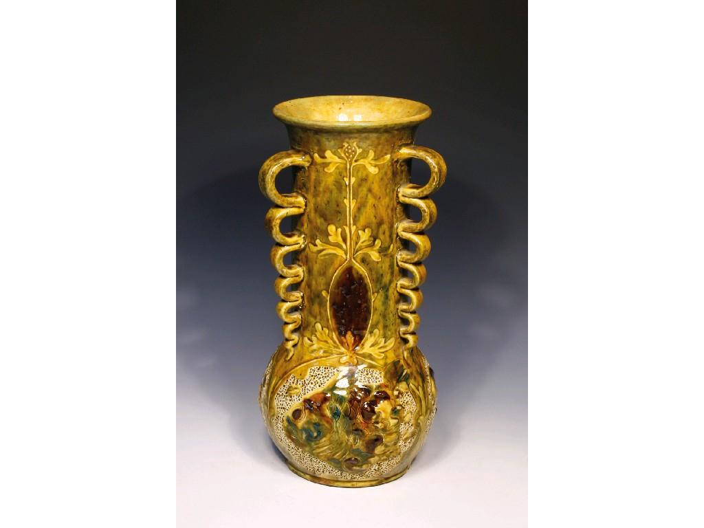 Appraisal: A BRANNAM WARE VASE of slender baluster form with elongated