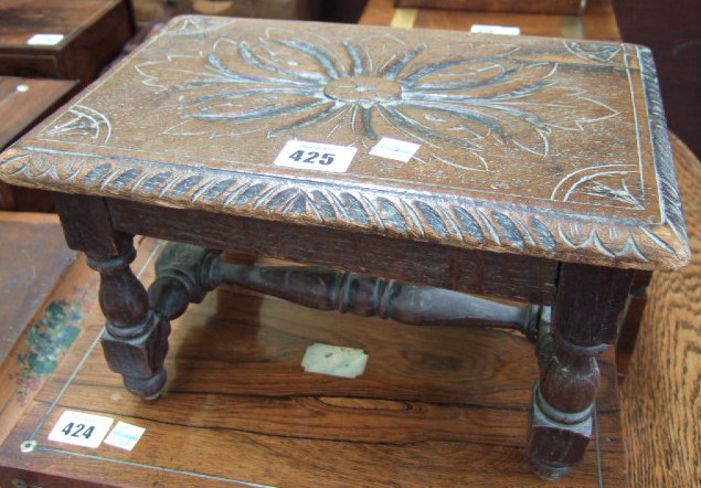 Appraisal: A th century oak foot stool the carved top over